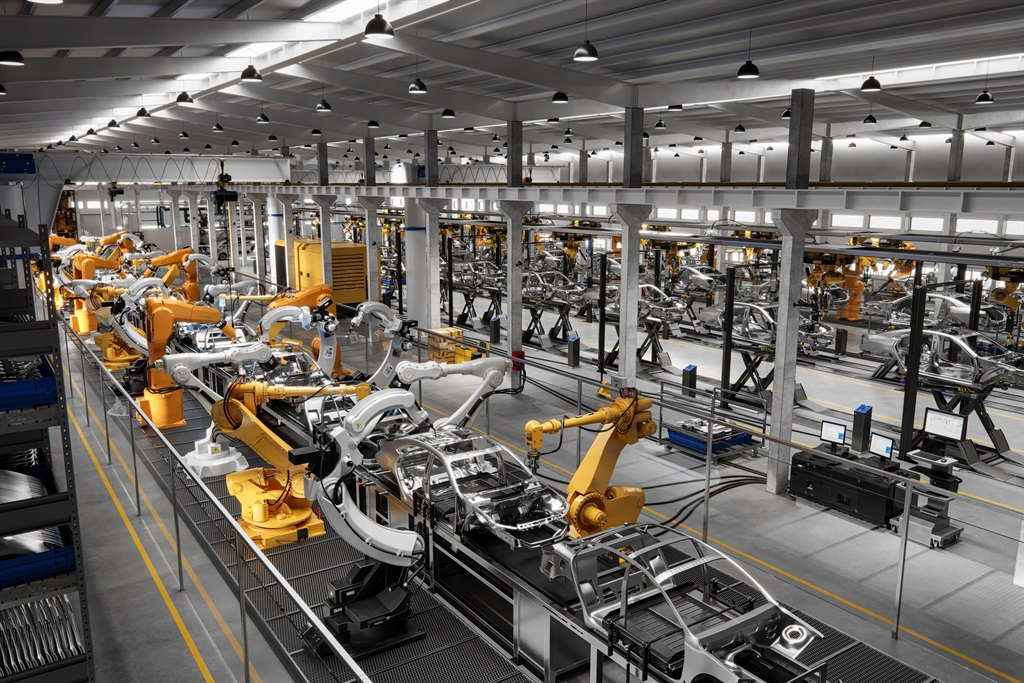 ROI of AI Automation: The Executive’s Guide A car factory with a line of robotic arms