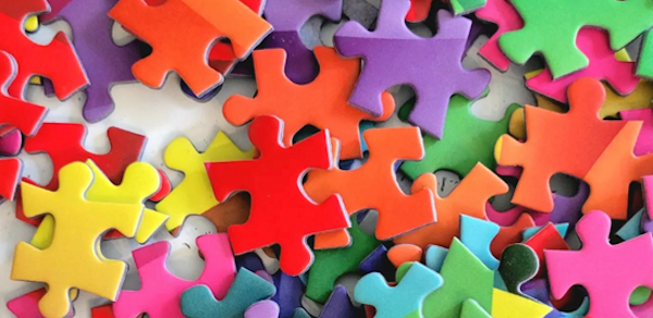 Multiple puzzle pieces of different colors